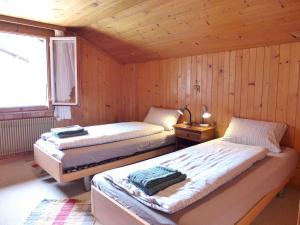 Postel nebo postele na pokoji v ubytování Apartment Vreneli by Interhome