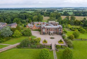 an aerial view of a large house with a large yard at The Chapel House Cheshire in Pickmere
