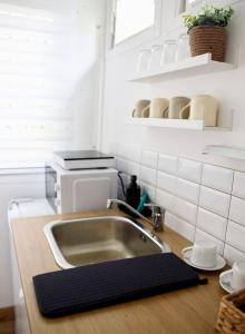 Kuchyňa alebo kuchynka v ubytovaní Nordin Apartman