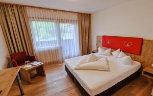 Das Alpin - Hotel Garni Guesthouse 객실 침대