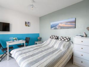 a bedroom with a bed and a desk at Studio Port Arcachon-6 by Interhome in Arcachon