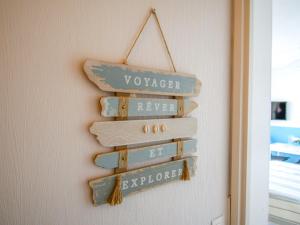 a group of signs hanging on a wall at Studio Port Arcachon-6 by Interhome in Arcachon
