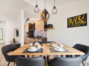 a dining room with a wooden table and chairs at Holiday Home Villa Maris by Interhome in Brtonigla +25 photos