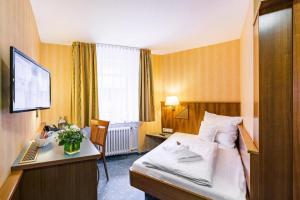 Voodi või voodid majutusasutuse Hotel Wartburg toas