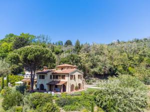 an aerial view of a house with trees at Villa Loris-2 by Interhome in Riparbella