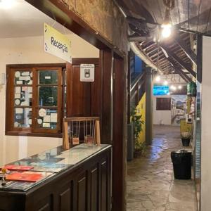 a shop with a glass counter in a building at Pousada Village Paraty Centro in Paraty