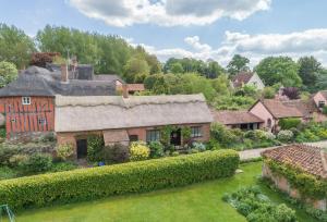 an aerial view of a house with a garden at Ayres End Studio in Kersey