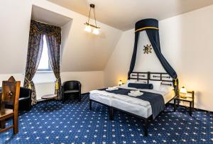 A bed or beds in a room at Hotel Grand Vígľaš Még 37 kép
