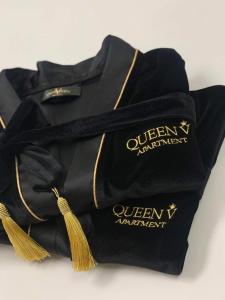 a black bag with gold writing on it at Luxury Queen V apartment with Jacuzzi in Kaunas