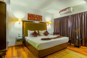Кровать или кровати в номере Gis Select Banjara Hill