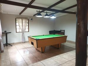 a living room with a pool table in it at Eagle Creek Resorts Sabie in Sabie