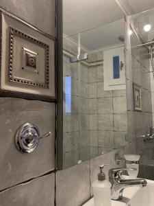 a bathroom with a sink and a shower at Sea and Salt Naxos 1 in Kastraki Naxou