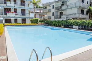 a large swimming pool in front of a building at Fondachello Mare dell'Etna in Fondachello +5 photos