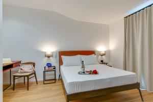 Postel nebo postele na pokoji v ubytování RoccaRegina Hotel