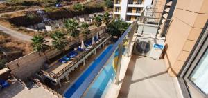 an overhead view of a swimming pool at a hotel at BlueCoast Apartment Vlore in Vlorë