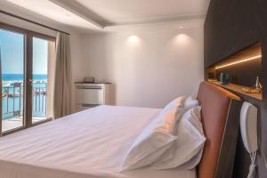Postel nebo postele na pokoji v ubytování RoccaRegina Hotel