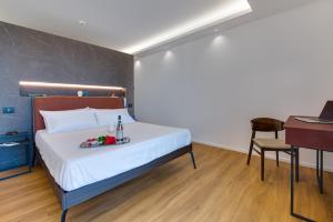 Postel nebo postele na pokoji v ubytování RoccaRegina Hotel
