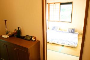 Postel nebo postele na pokoji v ubytování 山中湖リゾートハウスⅡ