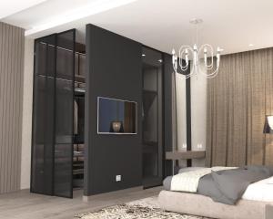 Un dormitorio con una pared negra y TV. en VIP Nizami EMIRATES, en Baku