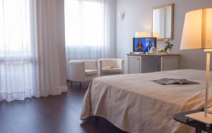 Postel nebo postele na pokoji v ubytování Hotel Terme Principe