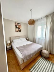 Ένα ή περισσότερα κρεβάτια σε δωμάτιο στο Apartment Dalmatino +19 φωτογραφίες