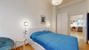 A bed or beds in a room at SAHI - Dei dell'Olimpo apartments Porta Romana
