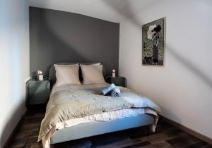 a bedroom with a bed with two end tables at Maison Ventoux in Carpentras