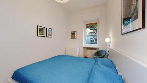 A bed or beds in a room at SAHI - Dei dell'Olimpo apartments Porta Romana