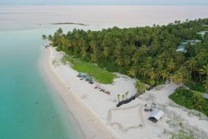 an aerial view of an island with a beach at Origami Inn Himandhoo in Himandhoo 