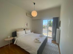 Postel nebo postele na pokoji v ubytování 2-bedroom apartment in Athina (Filopappou)