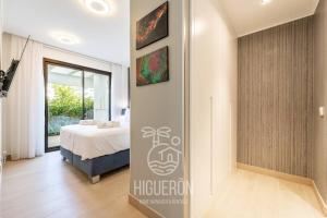 Posteľ alebo postele v izbe v ubytovaní HigueronRentals Greenhouse