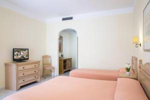 TV a/nebo společenská místnost v ubytování Hotel Maria Rosaria