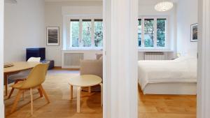 A bed or beds in a room at SAHI - Dei dell'Olimpo apartments Porta Romana