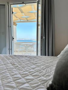 A bed or beds in a room at Paradiso Boutique