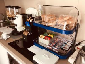 a kitchen counter with an open container of food at CINQUE OTTAVI B&B in Santa Marinella