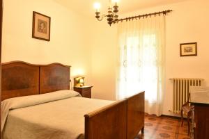 Postel nebo postele na pokoji v ubytování Hotel Madonna di Luciago