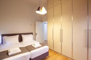 En eller flere senge i et værelse på Cactus Residence Chania + 20 billeder