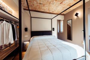 Postel nebo postele na pokoji v ubytování San Tommaso Suites