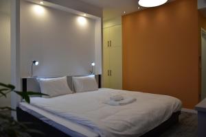 Postel nebo postele na pokoji v ubytování Osten Art Hotel