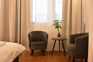 Postel nebo postele na pokoji v ubytování Osten Art Hotel