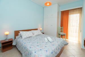 Ένα ή περισσότερα κρεβάτια σε δωμάτιο στο Yukas Home Xylokastro for 3 persons by MPS num 2