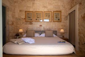 Posteľ alebo postele v izbe v ubytovaní Ostuni Art Resort