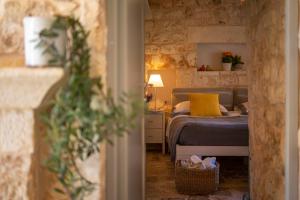 Posteľ alebo postele v izbe v ubytovaní Ostuni Art Resort