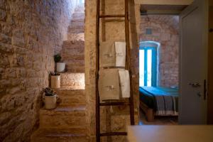 Posteľ alebo postele v izbe v ubytovaní Ostuni Art Resort