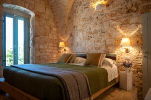 Posteľ alebo postele v izbe v ubytovaní Ostuni Art Resort