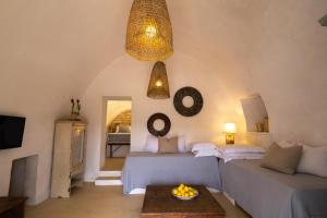 Giường trong phòng chung tại Masseria Soluco