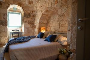 Posteľ alebo postele v izbe v ubytovaní Ostuni Art Resort
