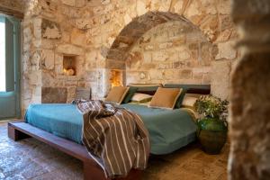 Posteľ alebo postele v izbe v ubytovaní Ostuni Art Resort