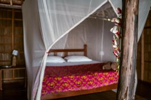 Ein Bett oder Betten in einem Zimmer der Unterkunft Methos Homestay - Raja Ampat