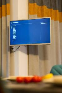 a computer monitor sitting on top of a table at Pine tree studio in St. St. Constantine and Helena